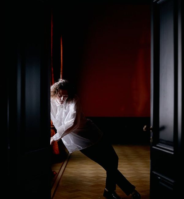 Man in a powerful stance with abstract energy lines.